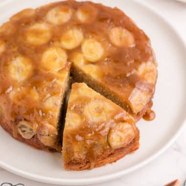 upside down banana cake with a slice cut out