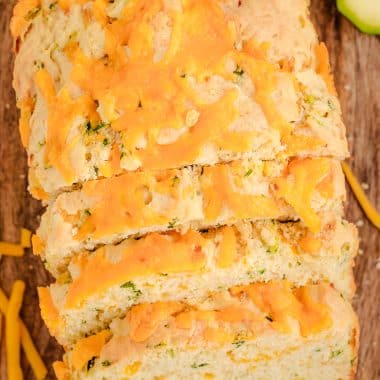 zucchini cheddar bread with melted cheese on top
