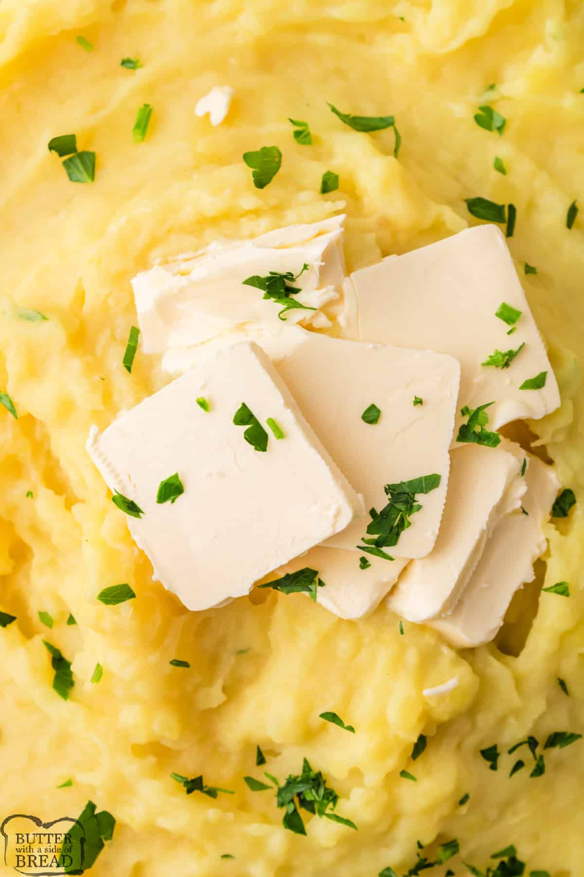Large serving of mashed potatoes with butter