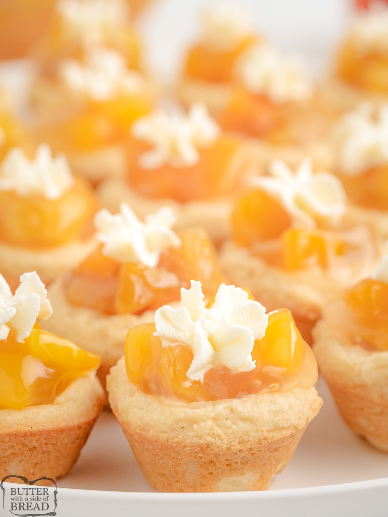 tray of peach cookie cups topped with sweet cream