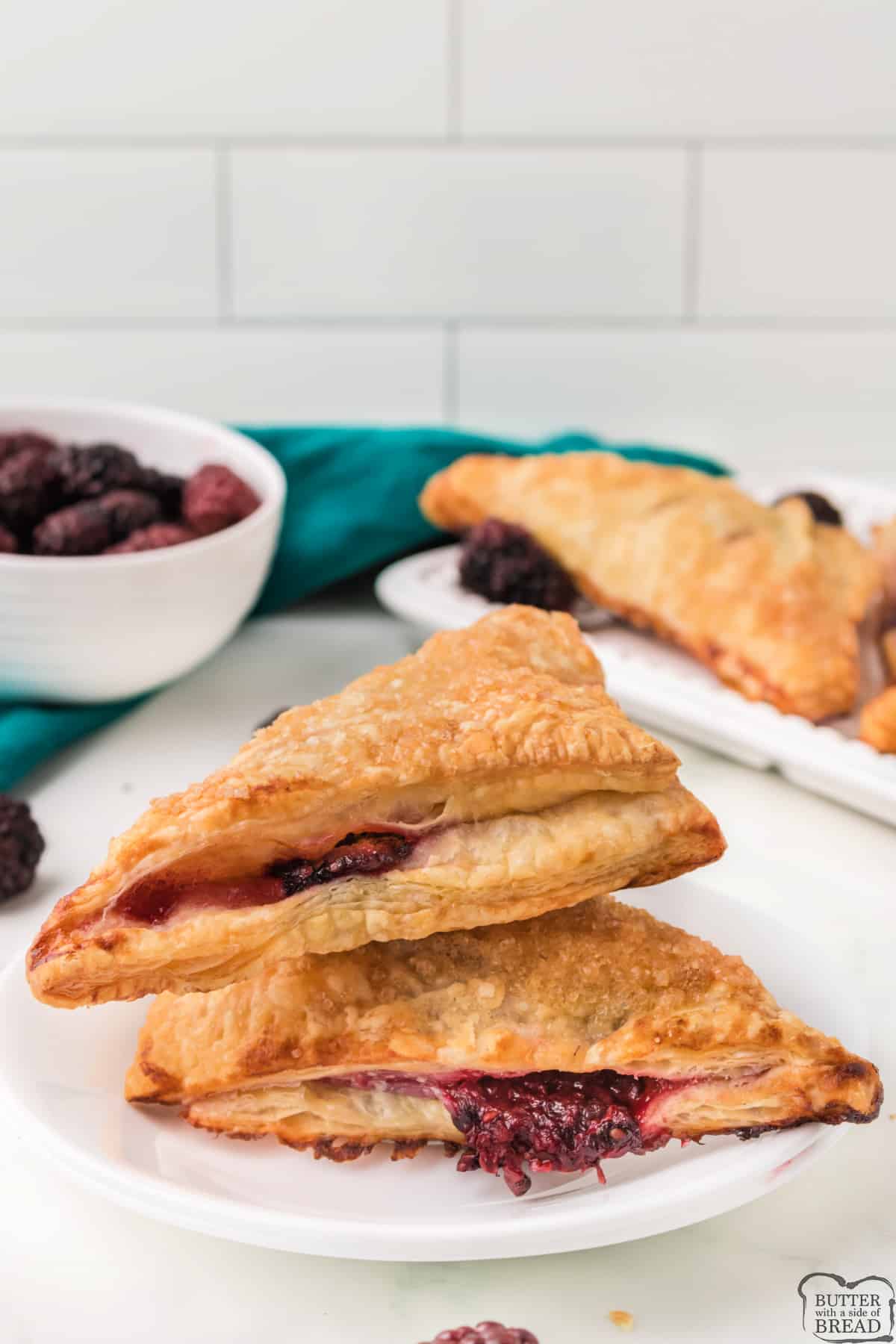 Easy Blackberry Turnovers made with puff pastry and fresh blackberries. A homemade blackberry filling is wrapped in puff pastry and then drizzled with a simple icing. 