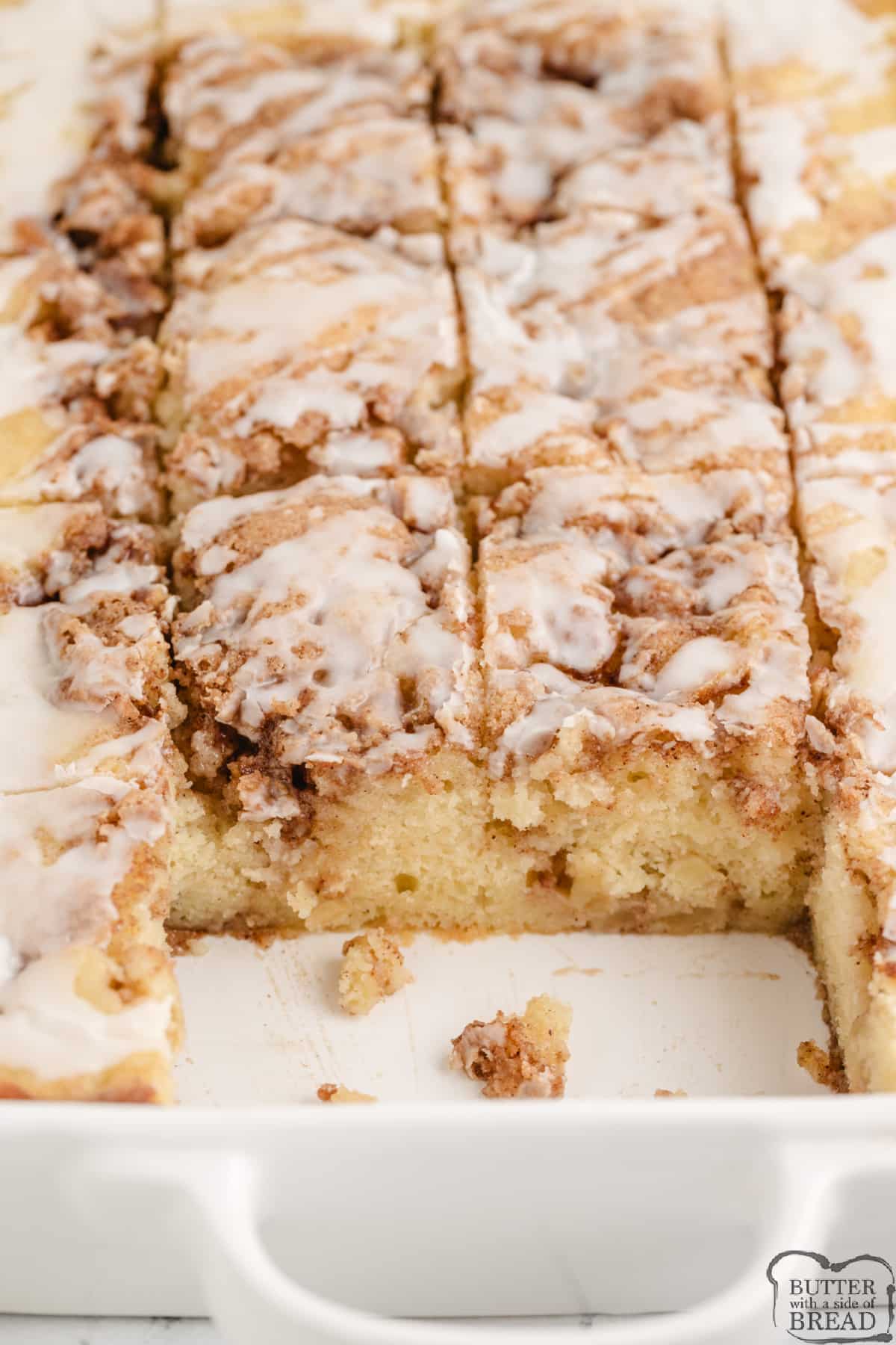 Apple cake with cinnamon crumb topping and glaze.