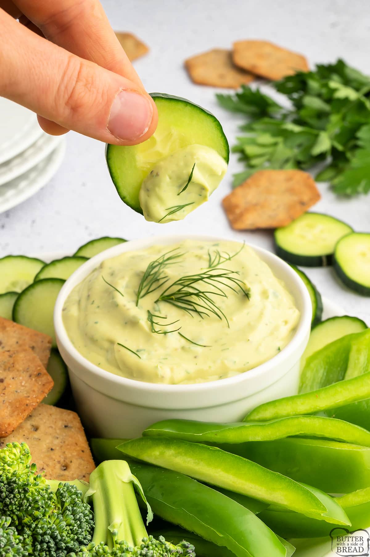 Cucumber dipped in homemade ranch dressing with avocado