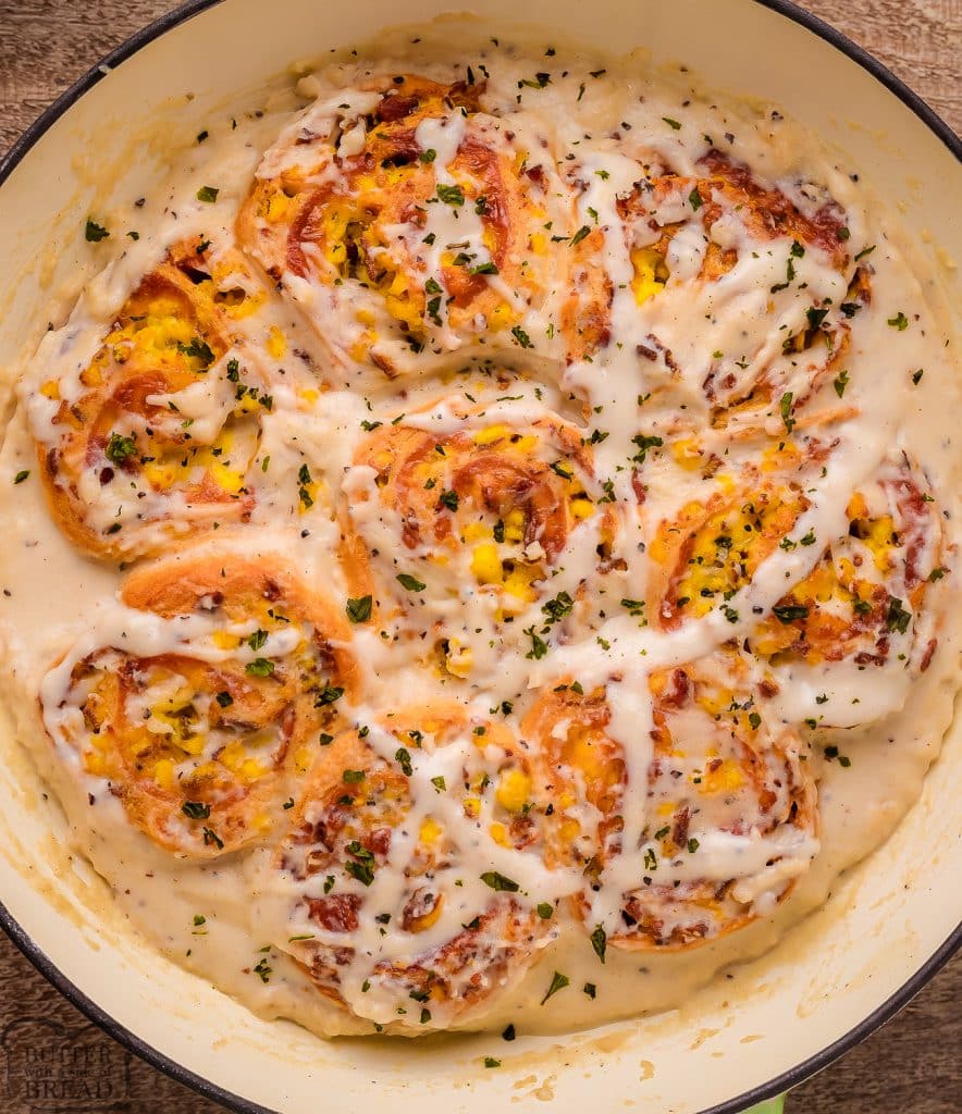 bacon and egg breakfast rolls with gravy on top