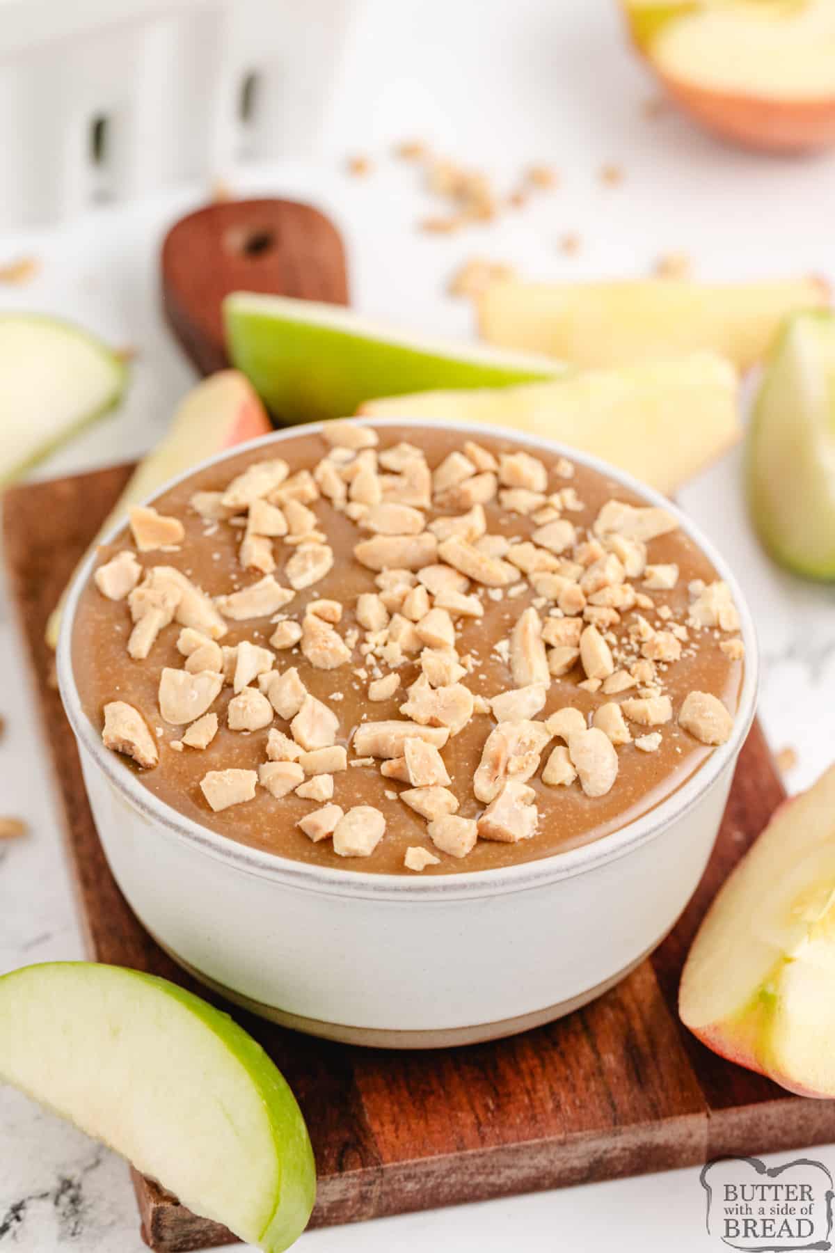 Caramel peanut butter dip topped with chopped peanuts. 