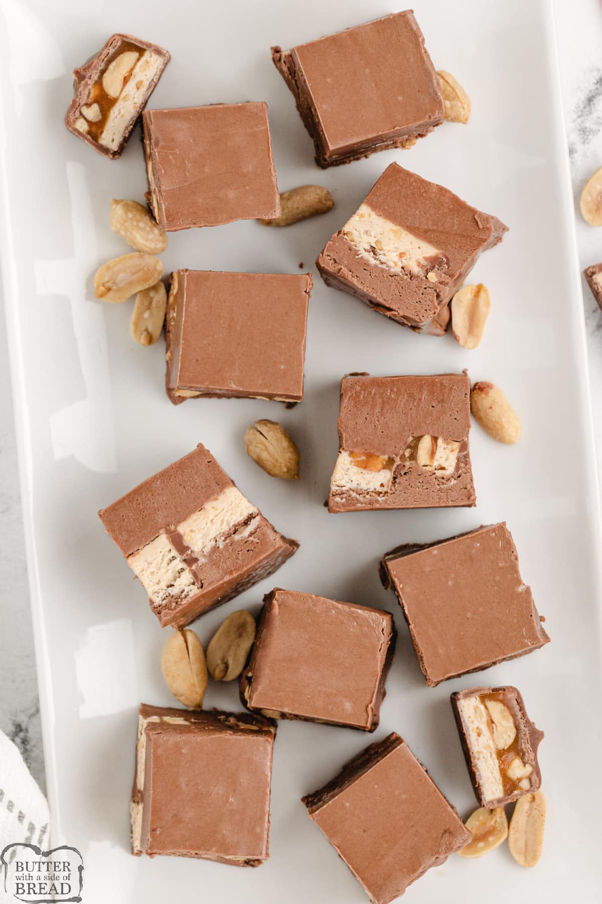 Chocolate fudge with sliced Snickers bars in the middle.