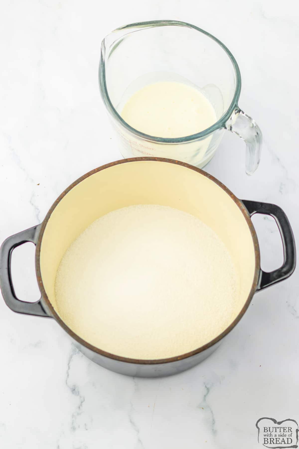Sugar and cream in pot to make homemade caramel recipe.