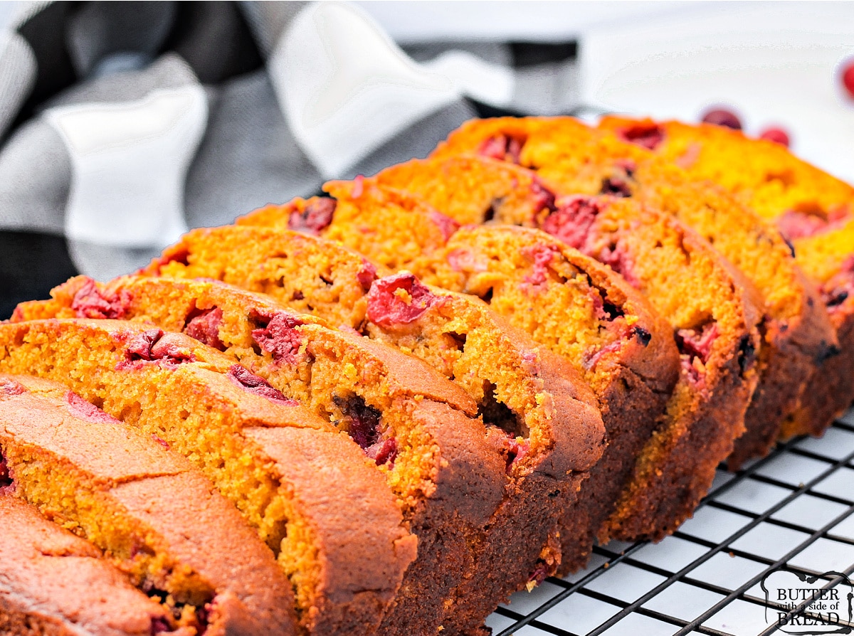 Loaf of pumpkin bread with orange juice and cranberries