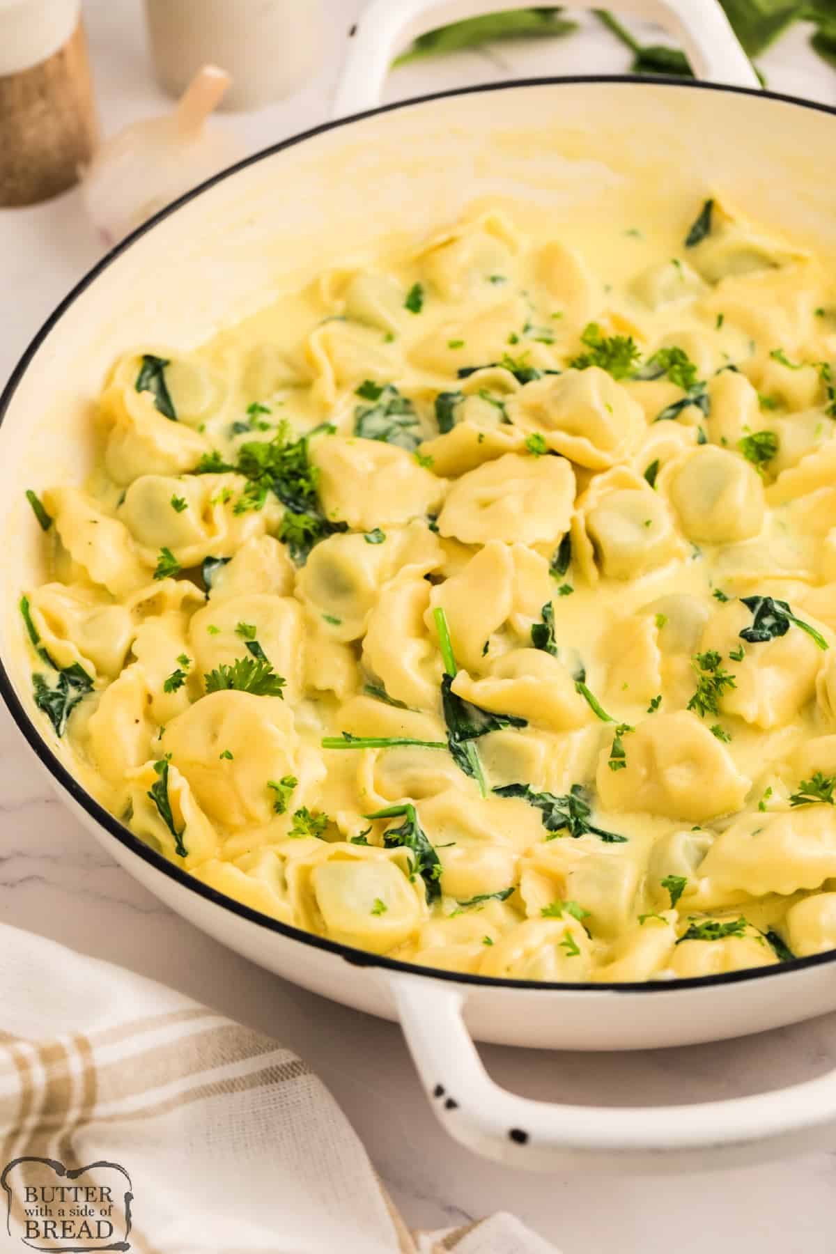 Cheese tortellini with alfredo sauce and spinach. 