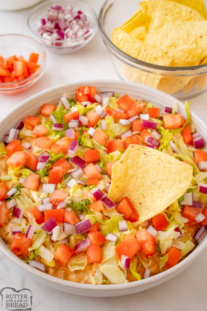 cheeseburger dip in a bowl with tortilla chips