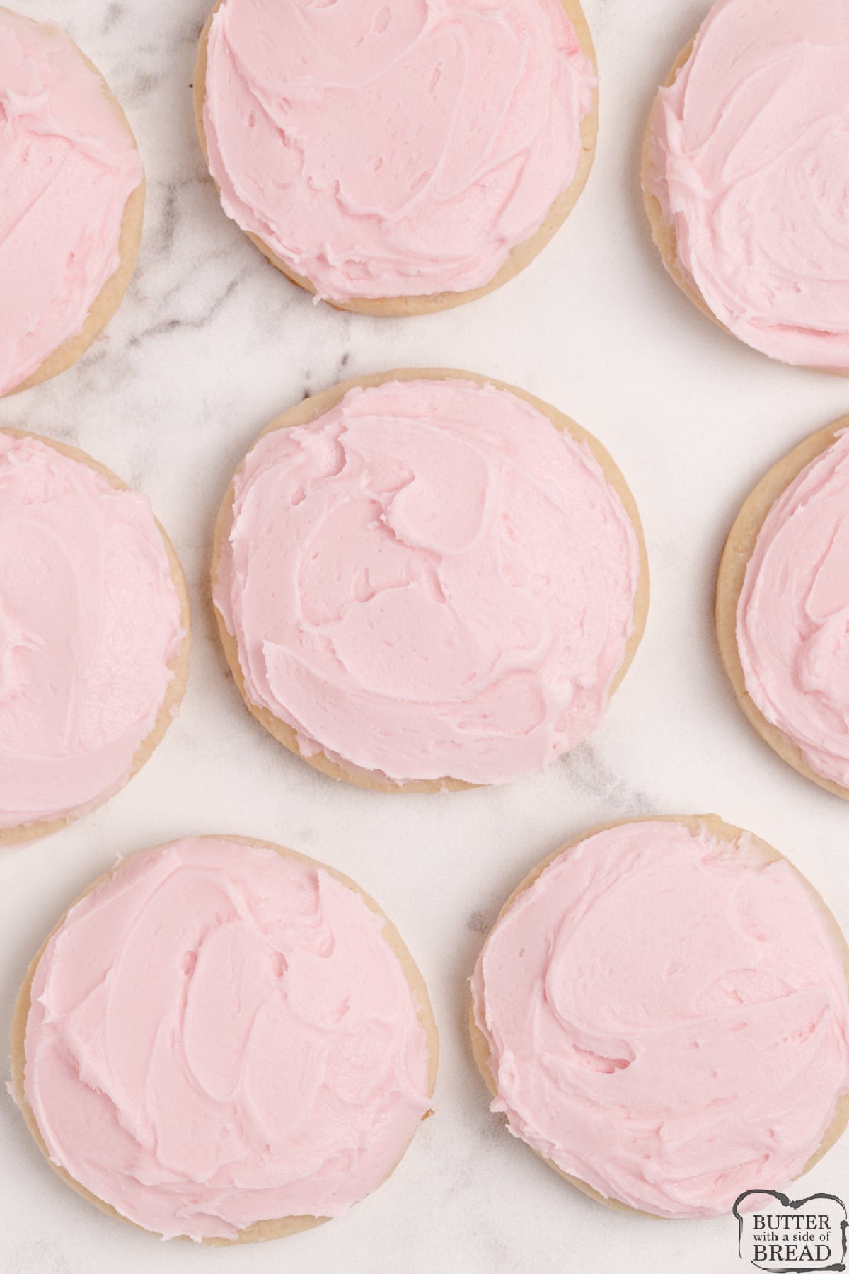 Sugar cookies with pink buttercream frosting. 
