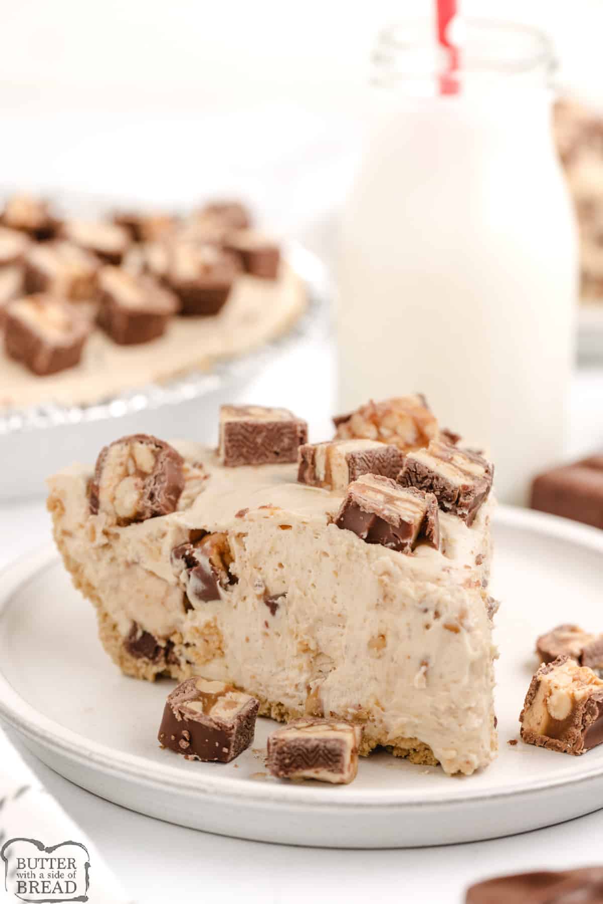 Slice of no bake peanut butter pie with Snickers.