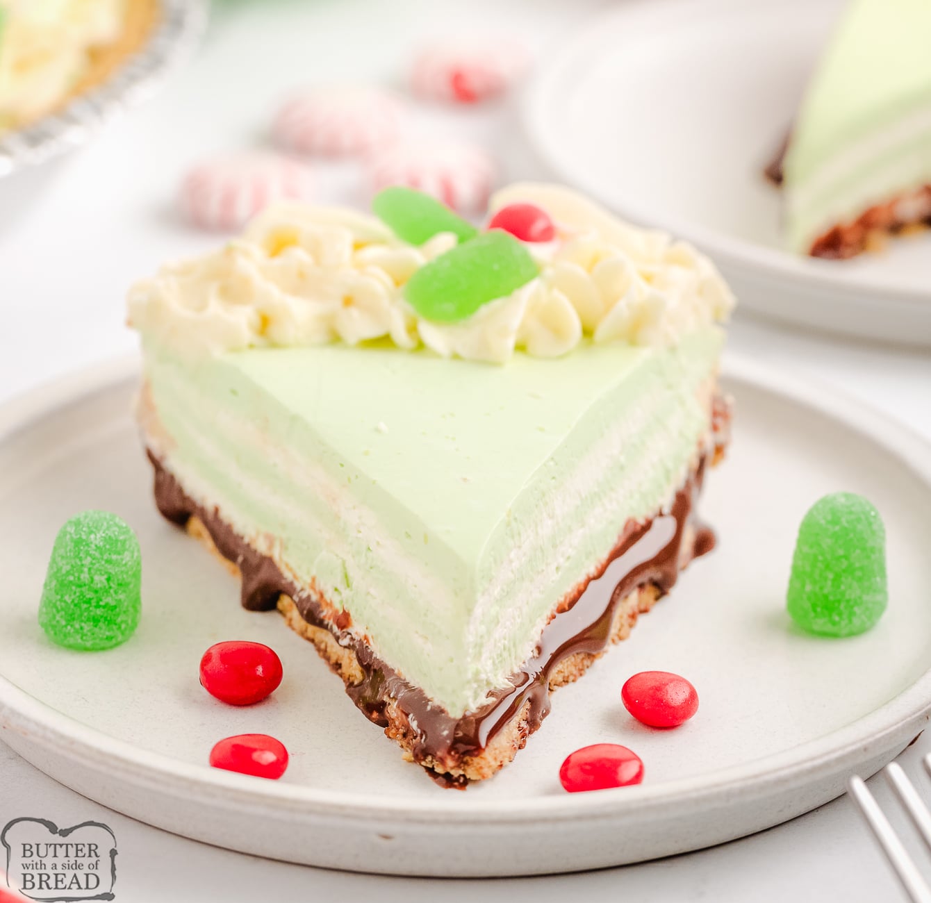 slice of layered green peppermint cream pie on a plate