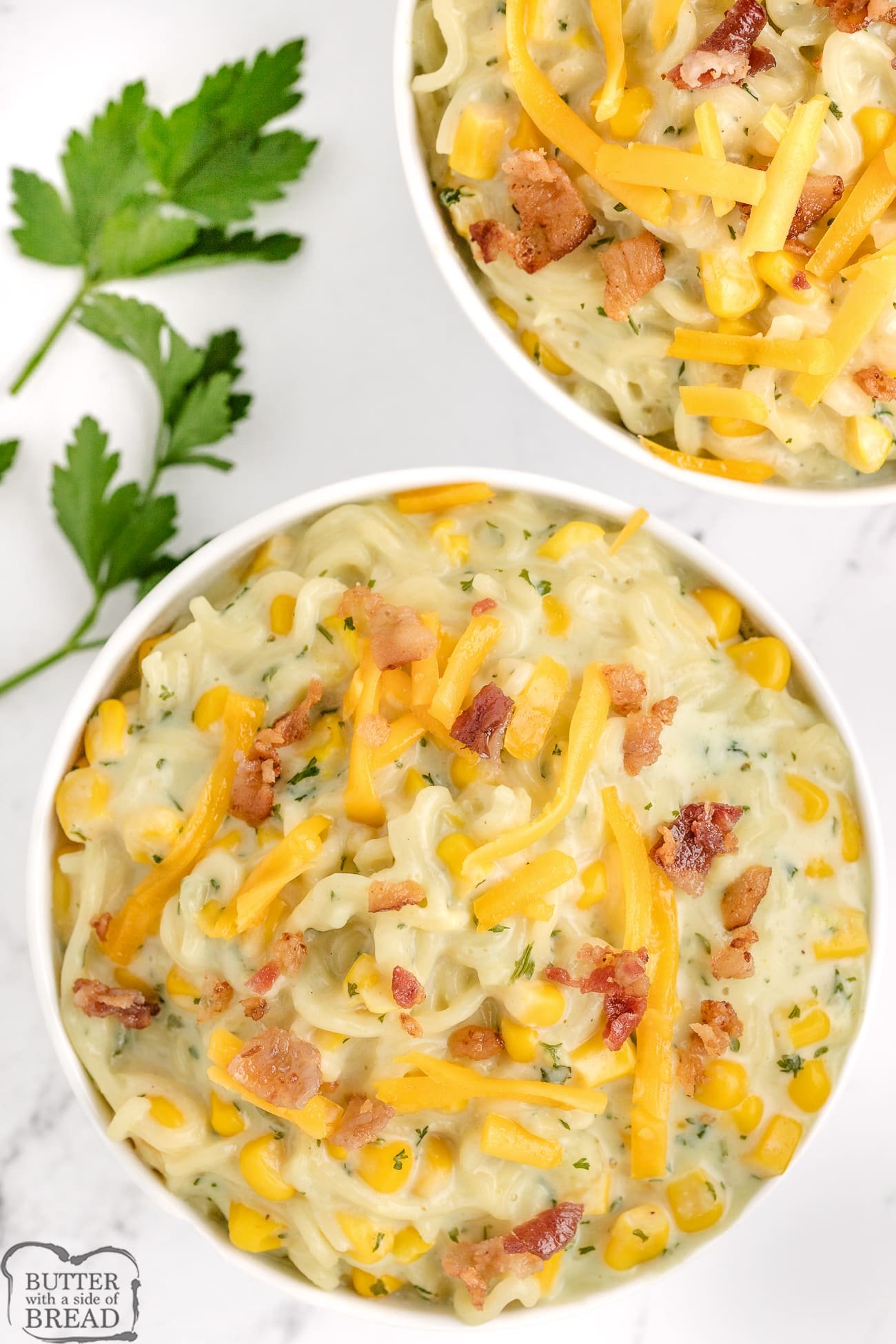 bowls of ramen chowder topped with bacon and cheese