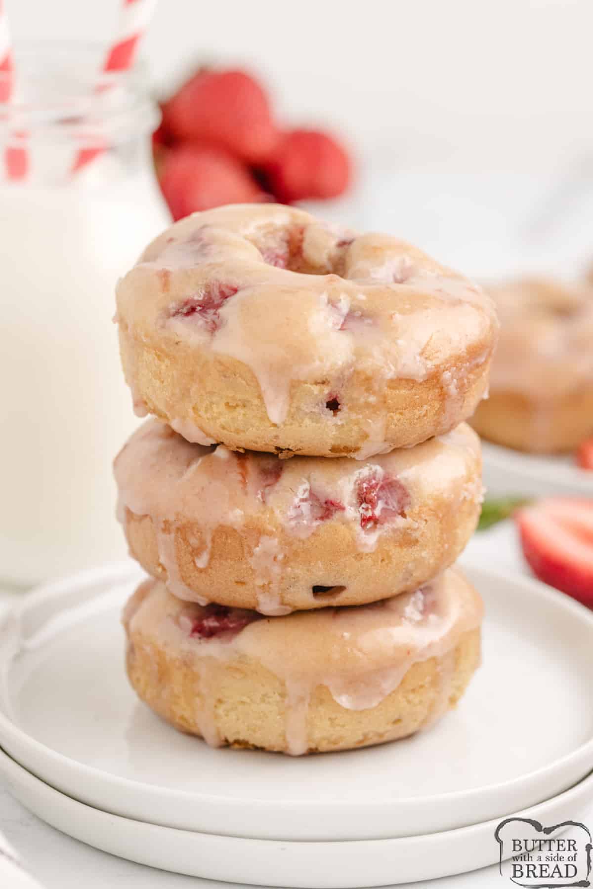 Stack of fresh donuts with strawberries. 