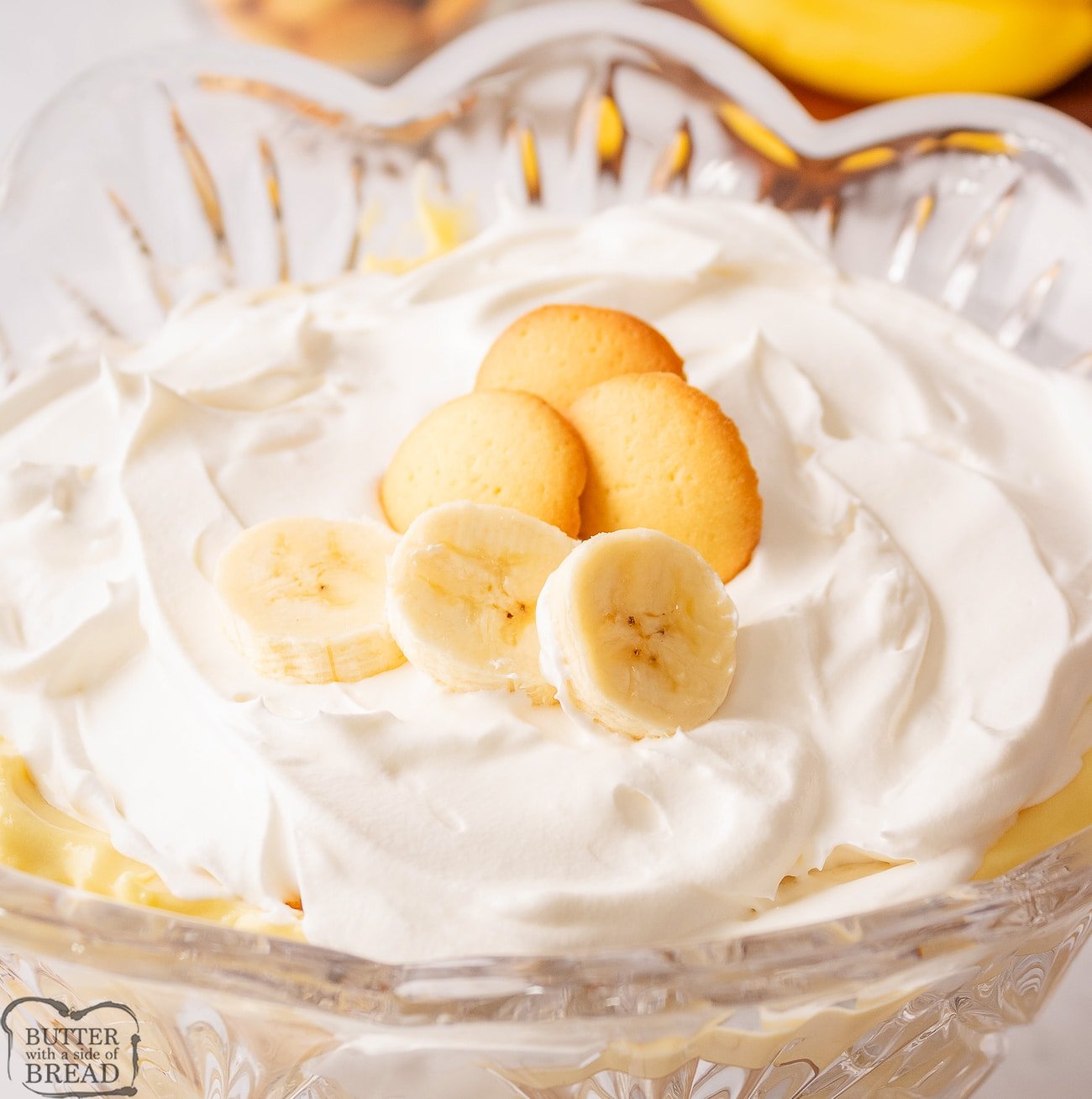 Easy banana pudding layered in a pretty glass trifle bowl