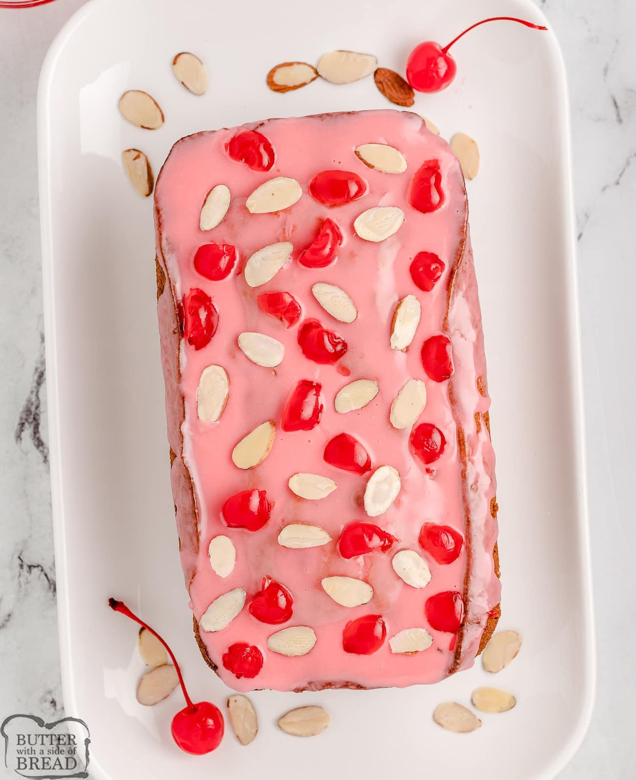 cherry almond sweet bread loaf with a glaze on top