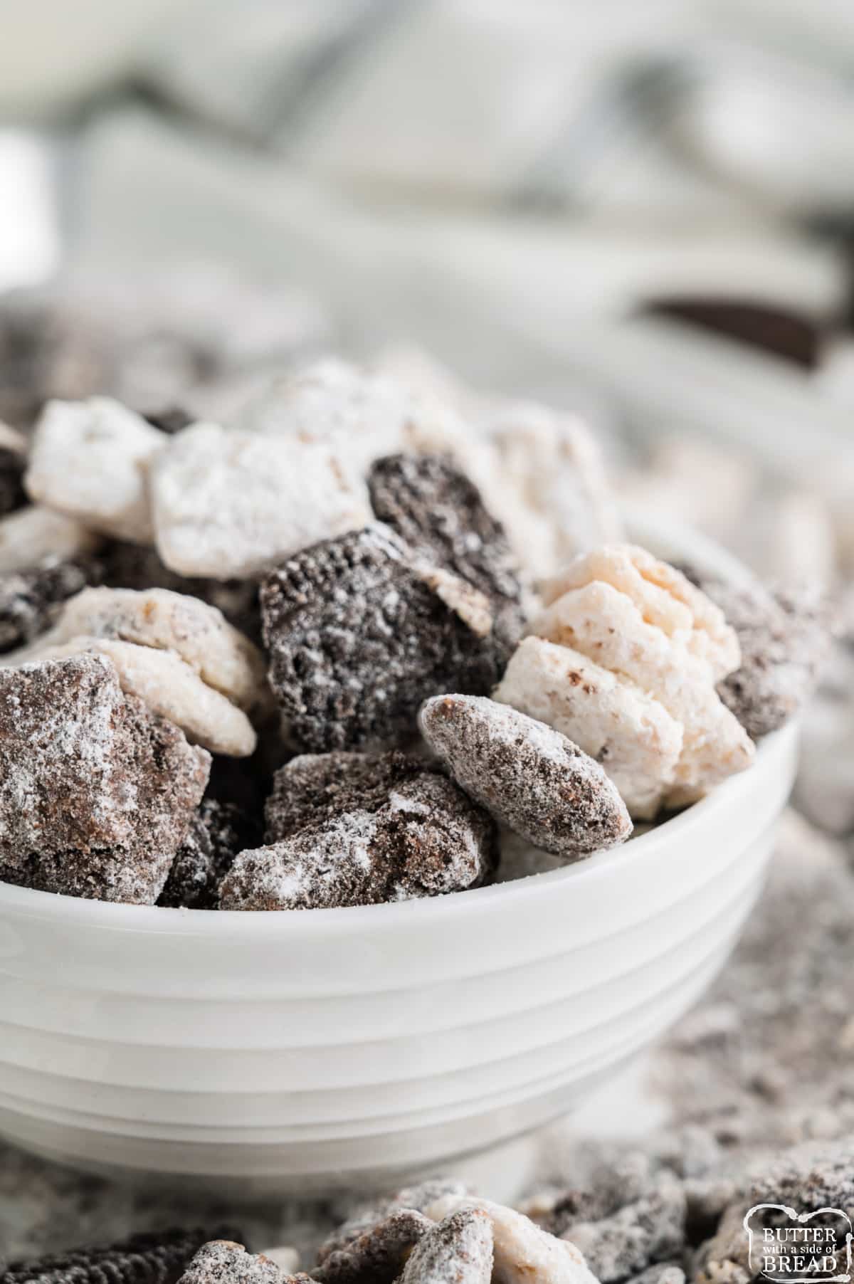 Cookies and Cream Muddy Buddies recipe made with Chex cereal, semi-sweet and white chocolate, powdered sugar and Oreo cookies. This delicious snack recipe is a huge crowd pleaser!