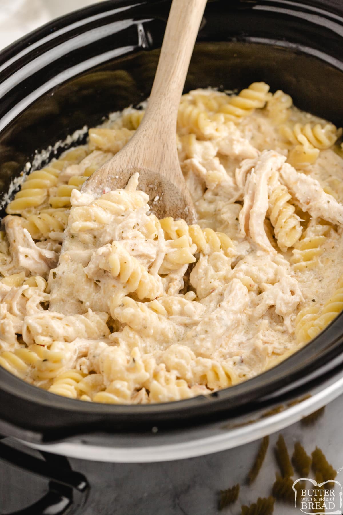 Crockpot Garlic Parmesan Chicken Pasta is made with 6 ingredients and only a few minutes of prep time. Easy weeknight dinner recipe that everyone loves! 