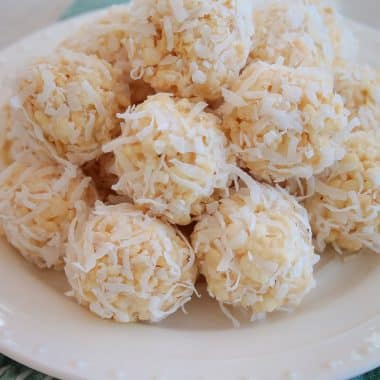 rice krispie coconut snowballs on a white plate