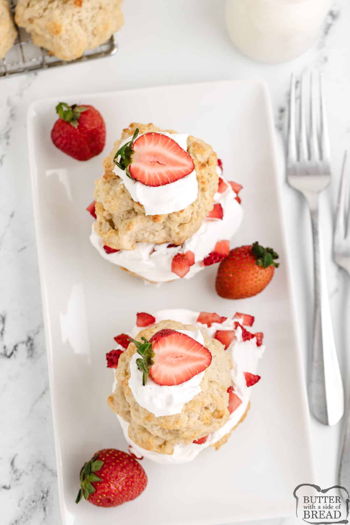 Individual shortcakes with whipped cream and strawberries.