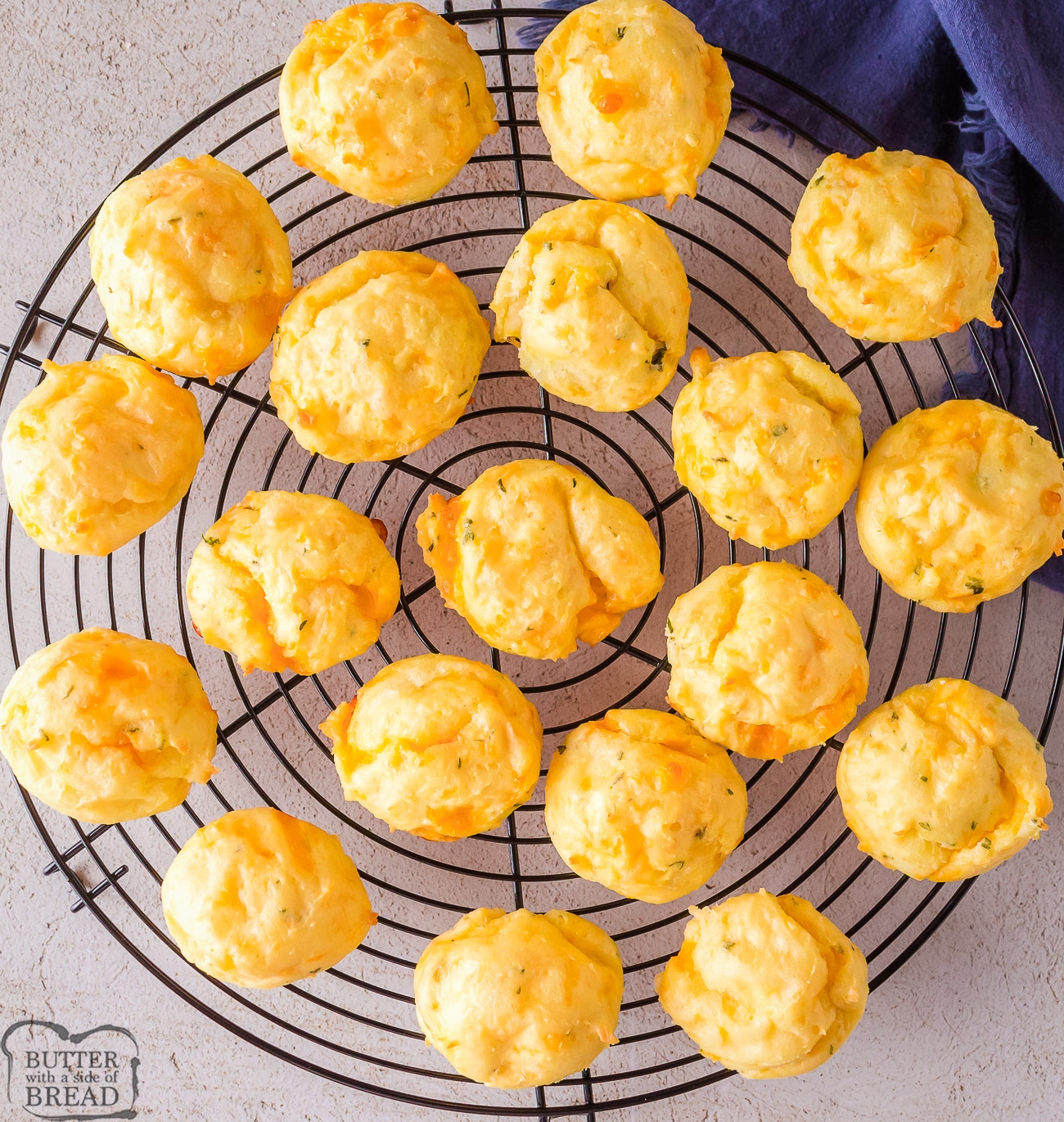 cheesy potato puffs on a cooling rack