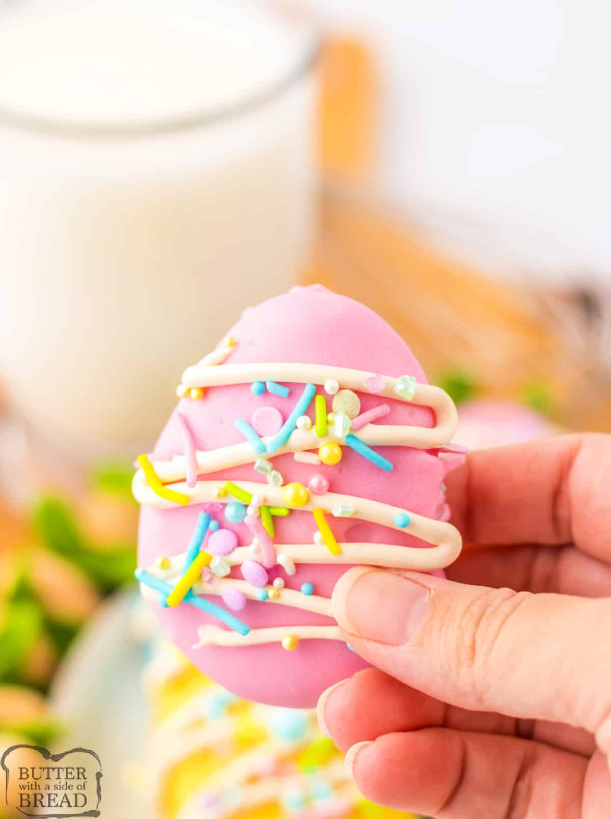 Pink easter egg cookie dough truffle with sprinkles.