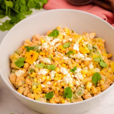 street corn salad with lime in a white bowl