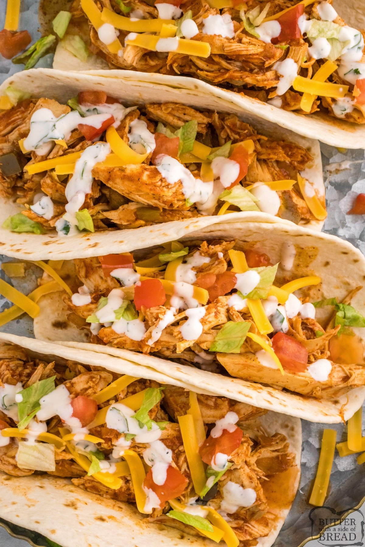 Slow Cooker Chicken Tacos are juicy and packed with flavor. Quick and easy dinner recipe that only requires a few minutes of prep time. 