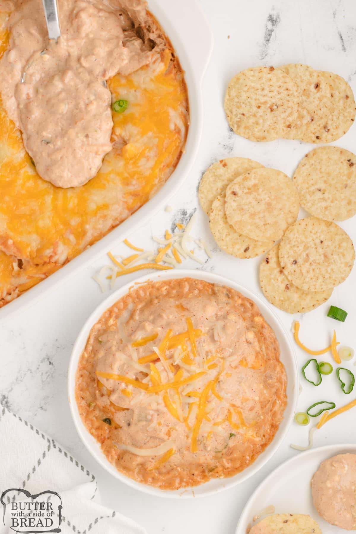 Refried bean dip made with salsa, cream cheese, sour cream, and melted cheese. 