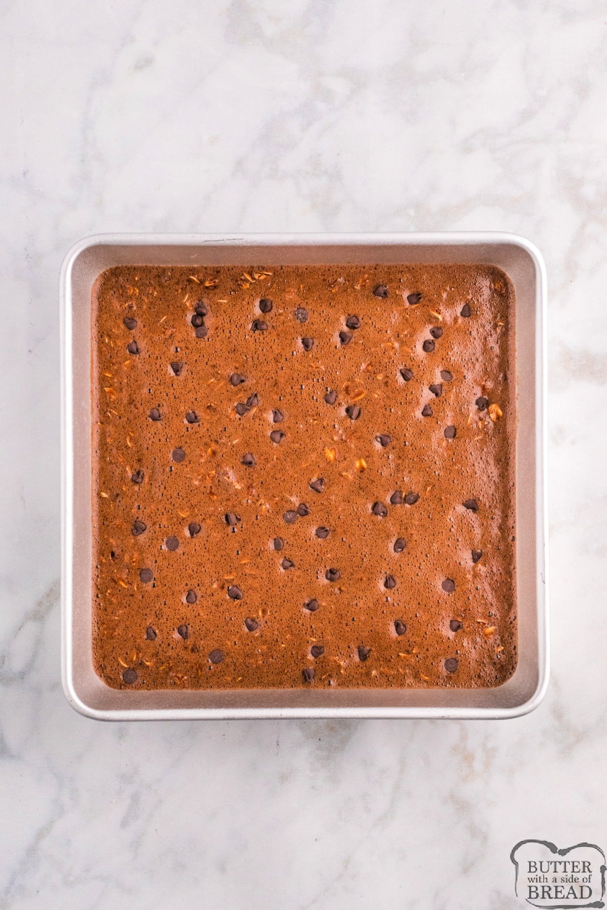 Chocolate baked oatmeal in 9X9 pan, ready to bake. 