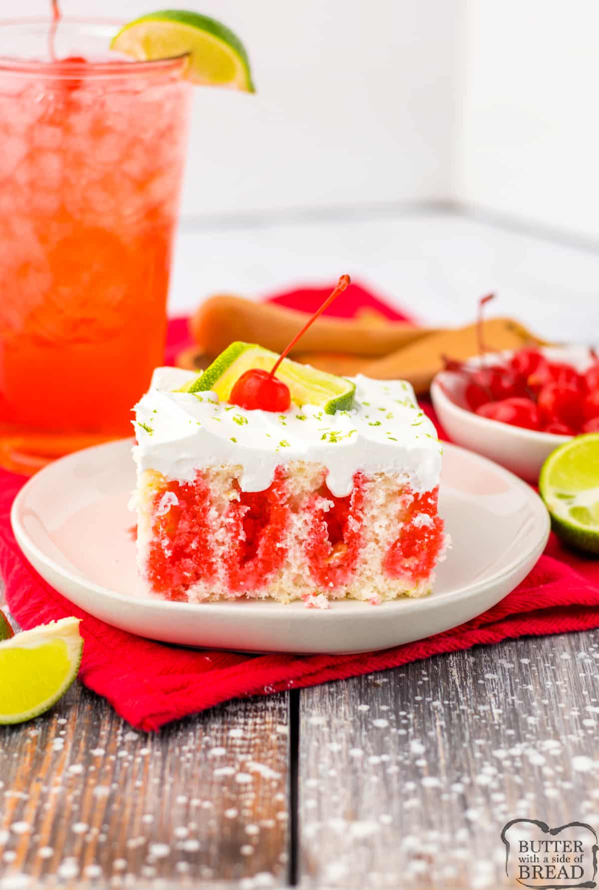 Cherry Limeade Poke Cake is made with cherry jello, whipped cream, lime zest, and maraschino cherries. This cake is cool and refreshing and tastes like a tall, icy glass of cherry limeade. 