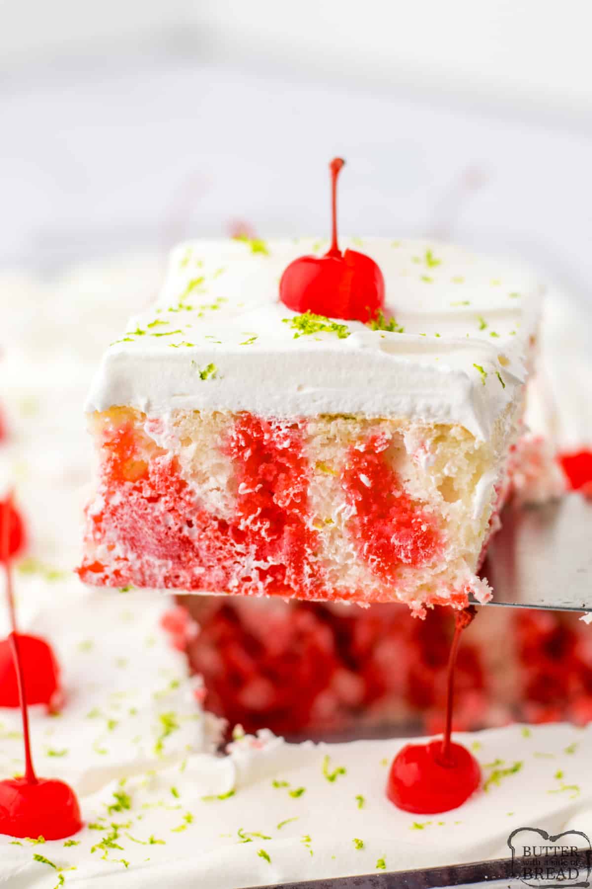 Slice of cake made with cherry jello and lime. 