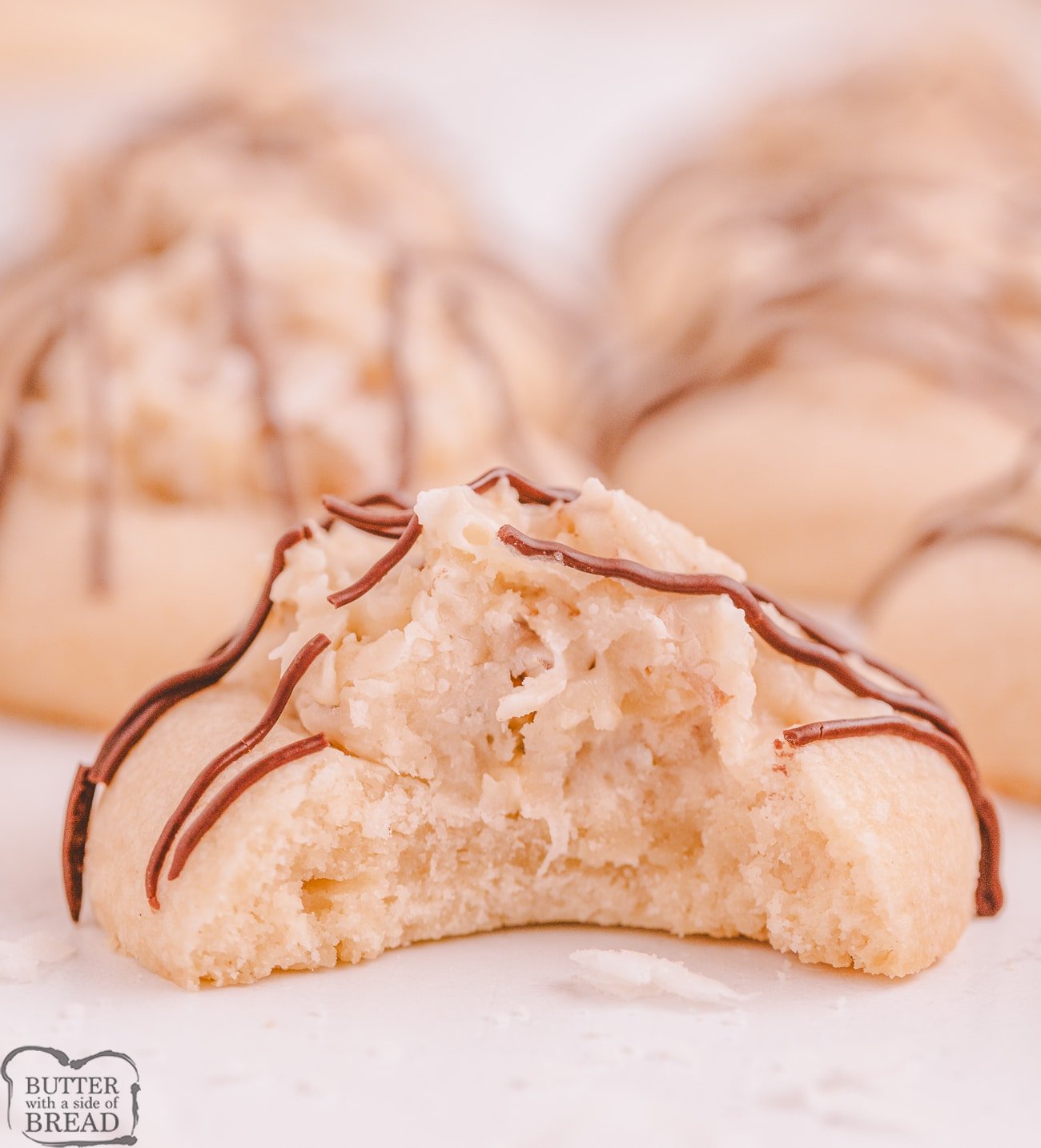bite into a coconut cream cookie drizzled with chocolate