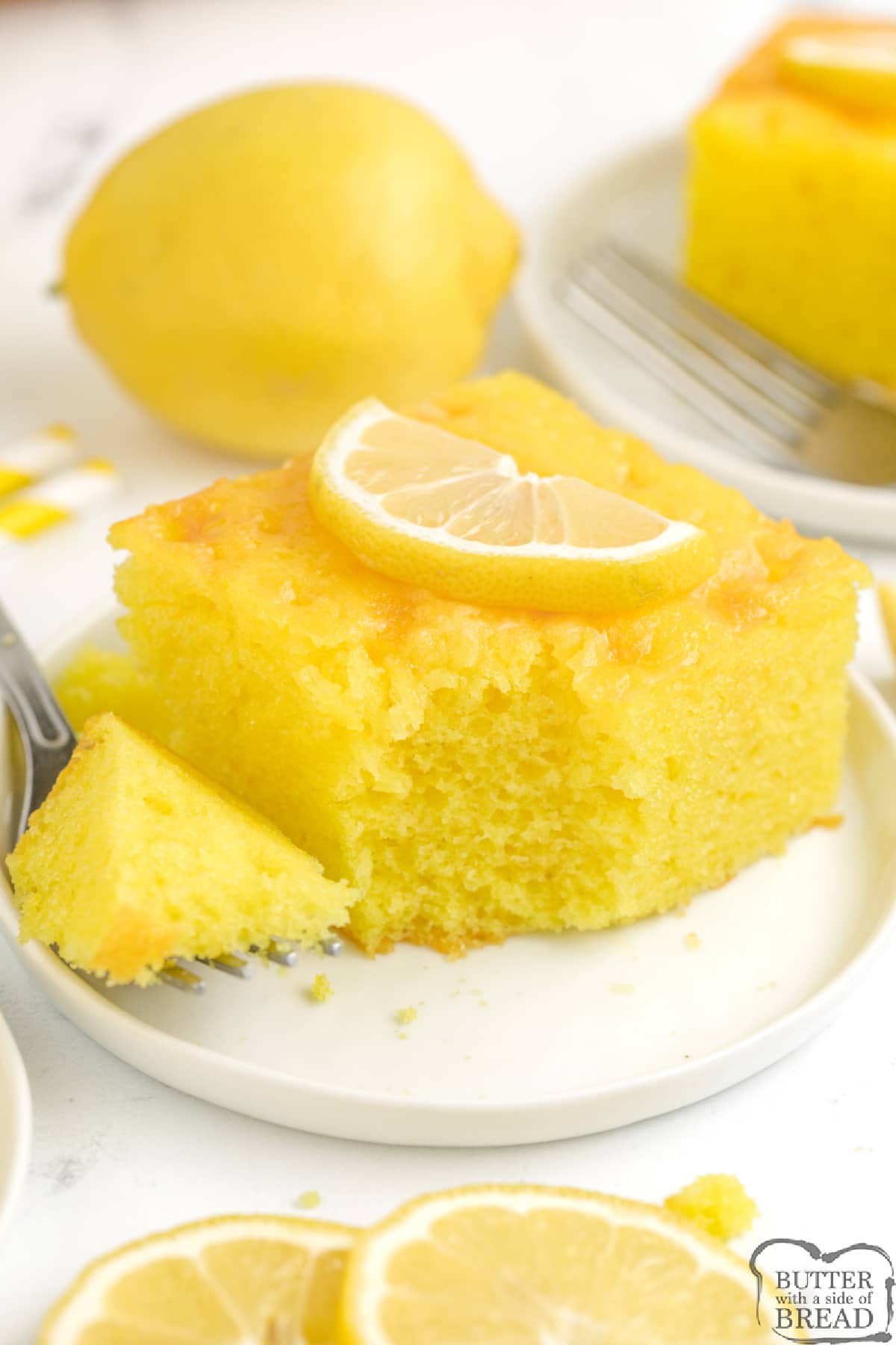 Lemon Jello Cake is easy to make and packed with tons of lemon flavor! This delicious cake is made with a lemon cake mix and lemon jello and topped with a simple lemon glaze.