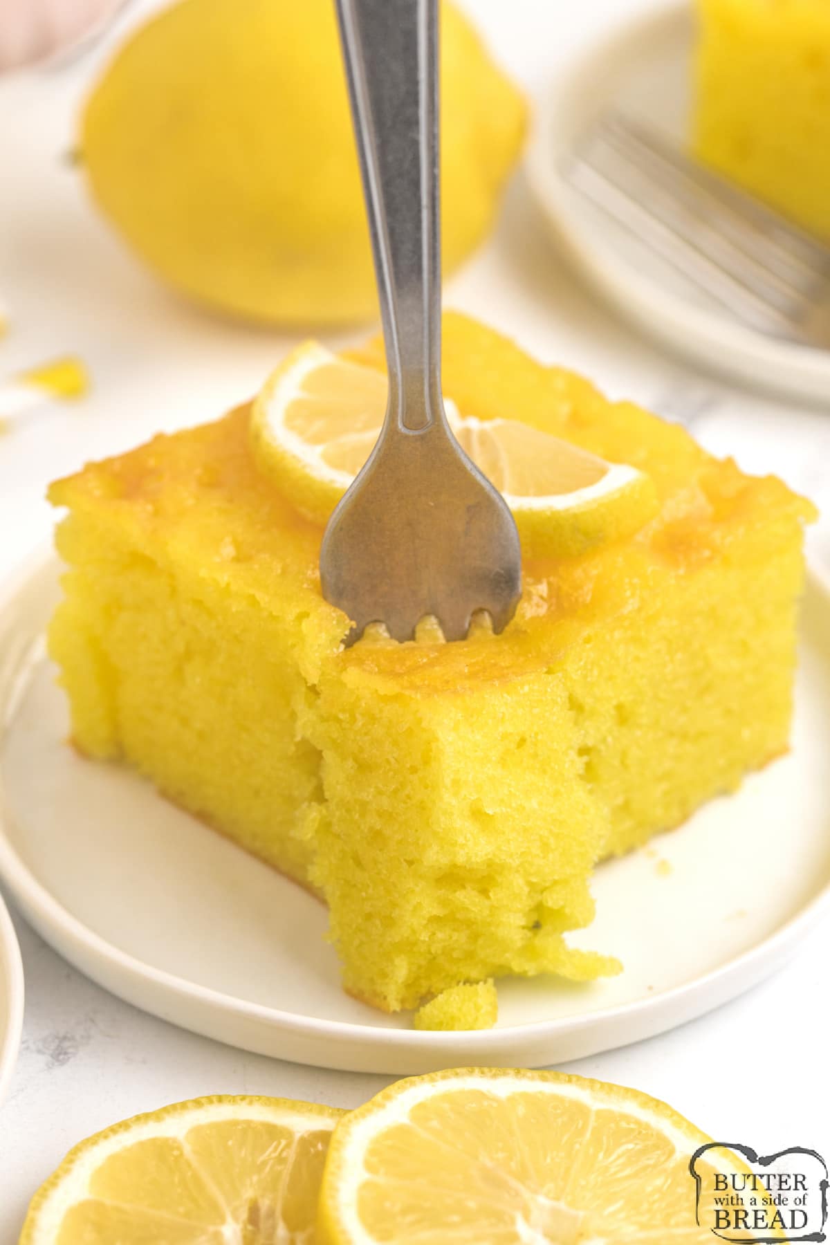 Bite of moist lemon cake. 