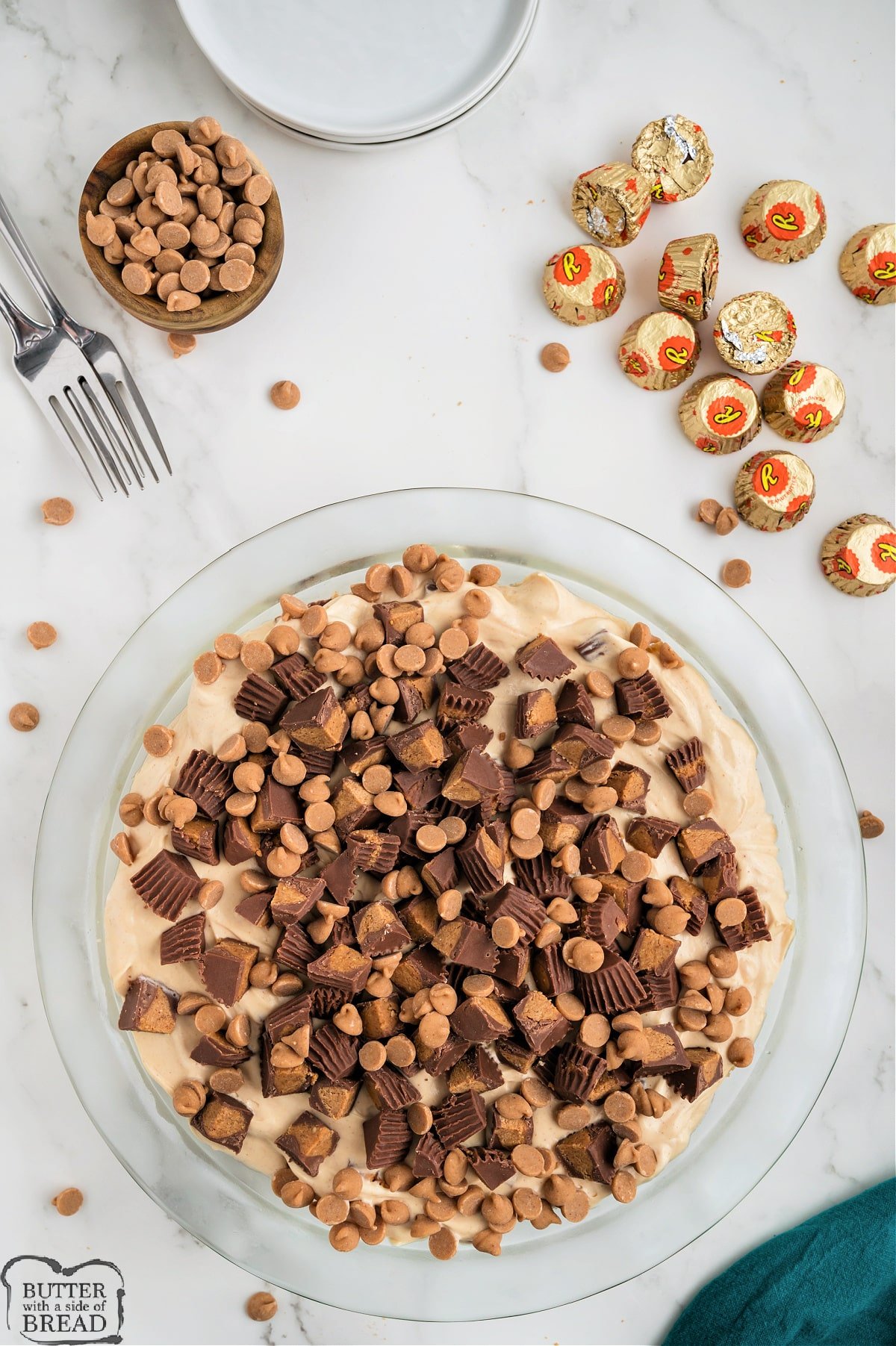 Sprinkle peanut butter cups and peanut butter chips on top of the peanut butter pie. 