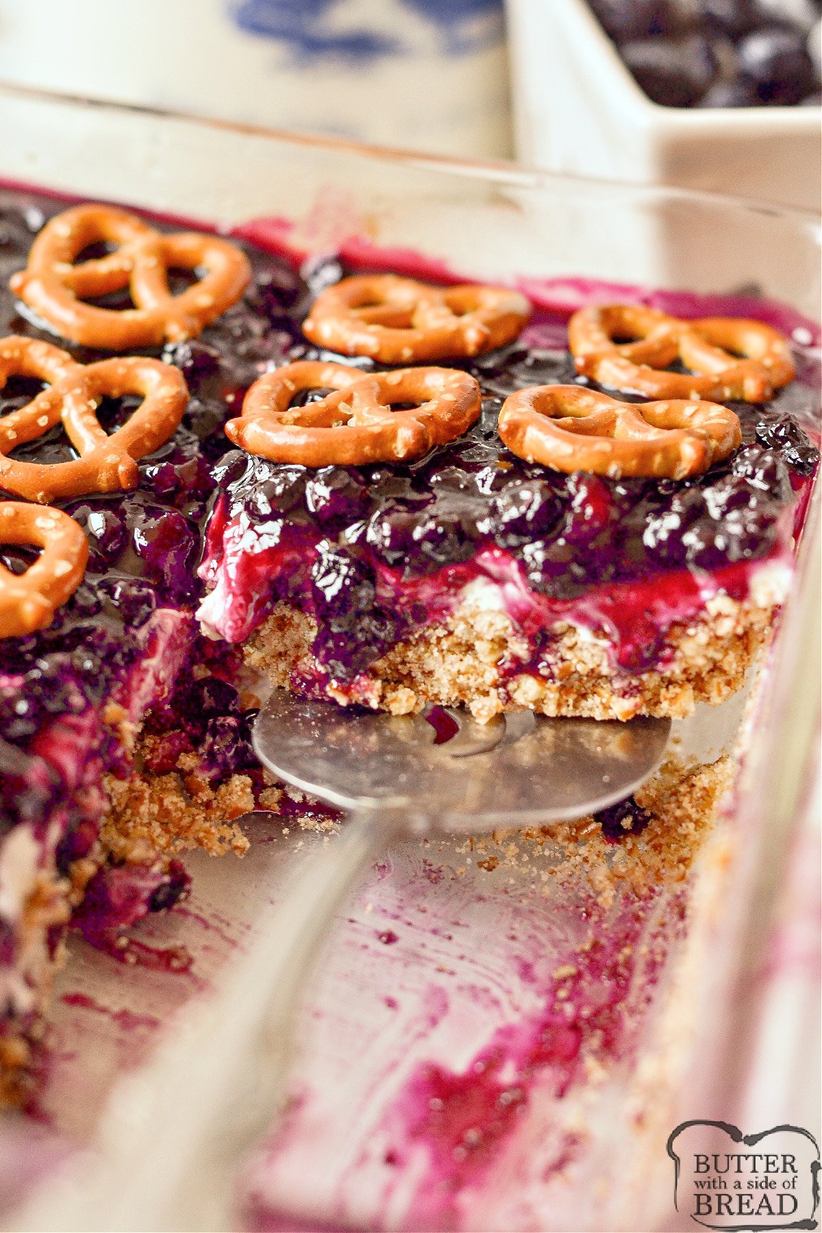 Blueberry Pretzel Salad is a delicious dessert that combines the salty crunch of pretzels with the sweet and tangy flavors of cream cheese and blueberries. This refreshing dessert is perfect for summer BBQs, birthday parties, and holiday dinner parties.