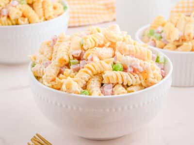 Ruby Tuesday pasta salad in a white bowl with a gold fork