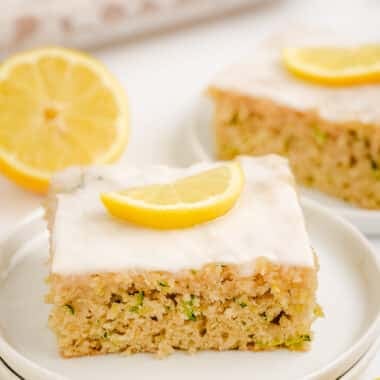 square of lemon zucchini cake on a white plate