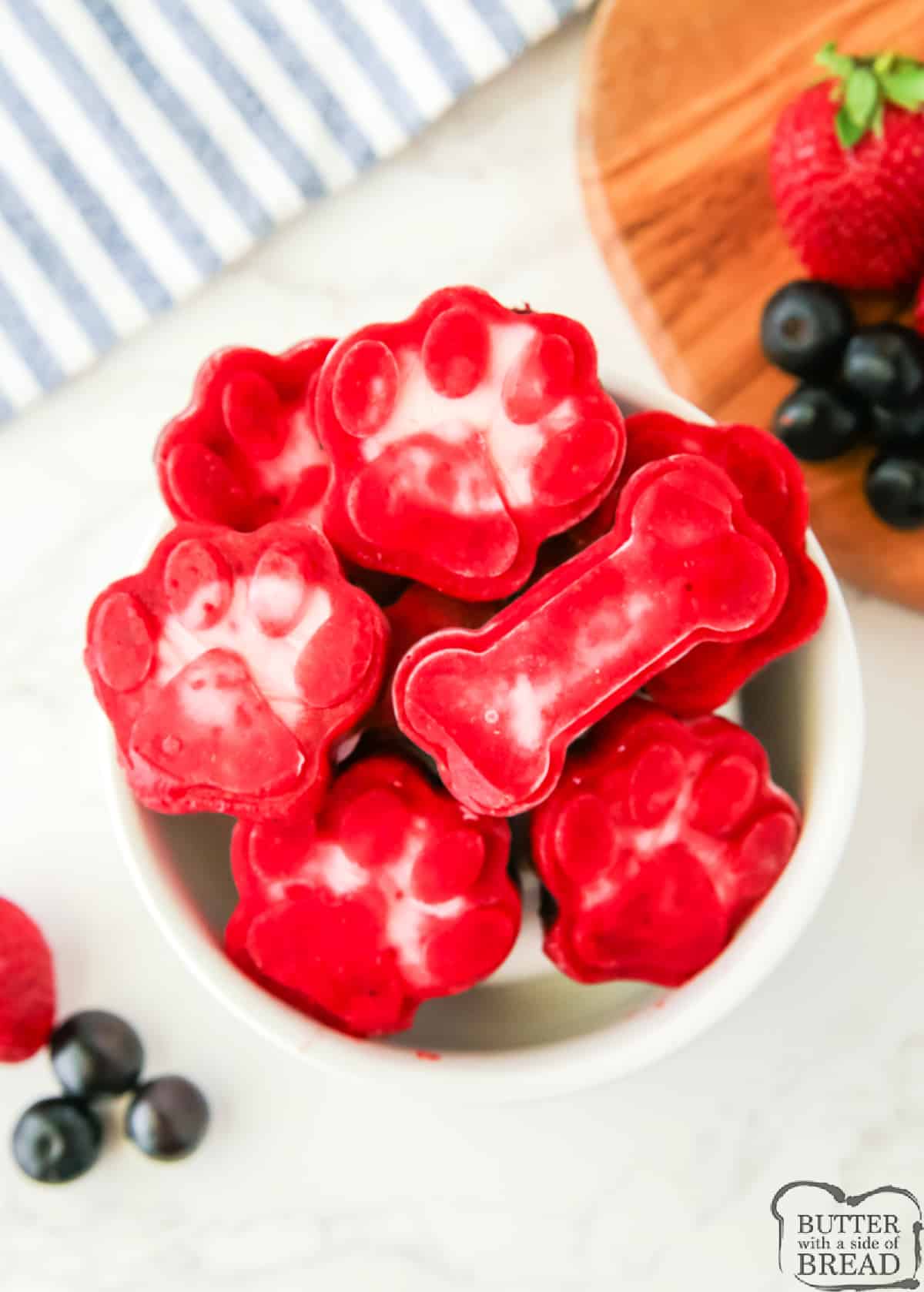 Mixed Berry Frozen Dog Treats are made with 3 simple ingredients and they are so refreshing for summer! Healthy dog treats are made with strawberries, blueberries, and Greek yogurt. 