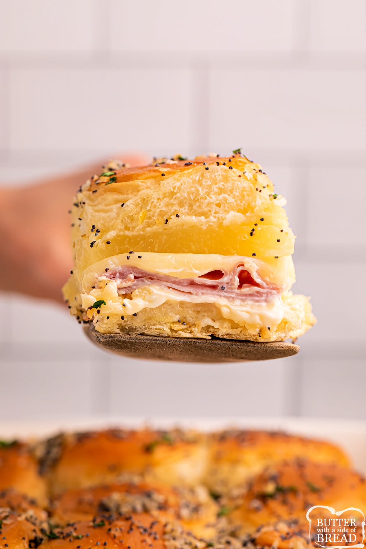 Pineapple Ham Sliders made with Hawaiian rolls, ham, cheese, and pineapple. A simple weeknight dinner that only takes a few minutes to prep!