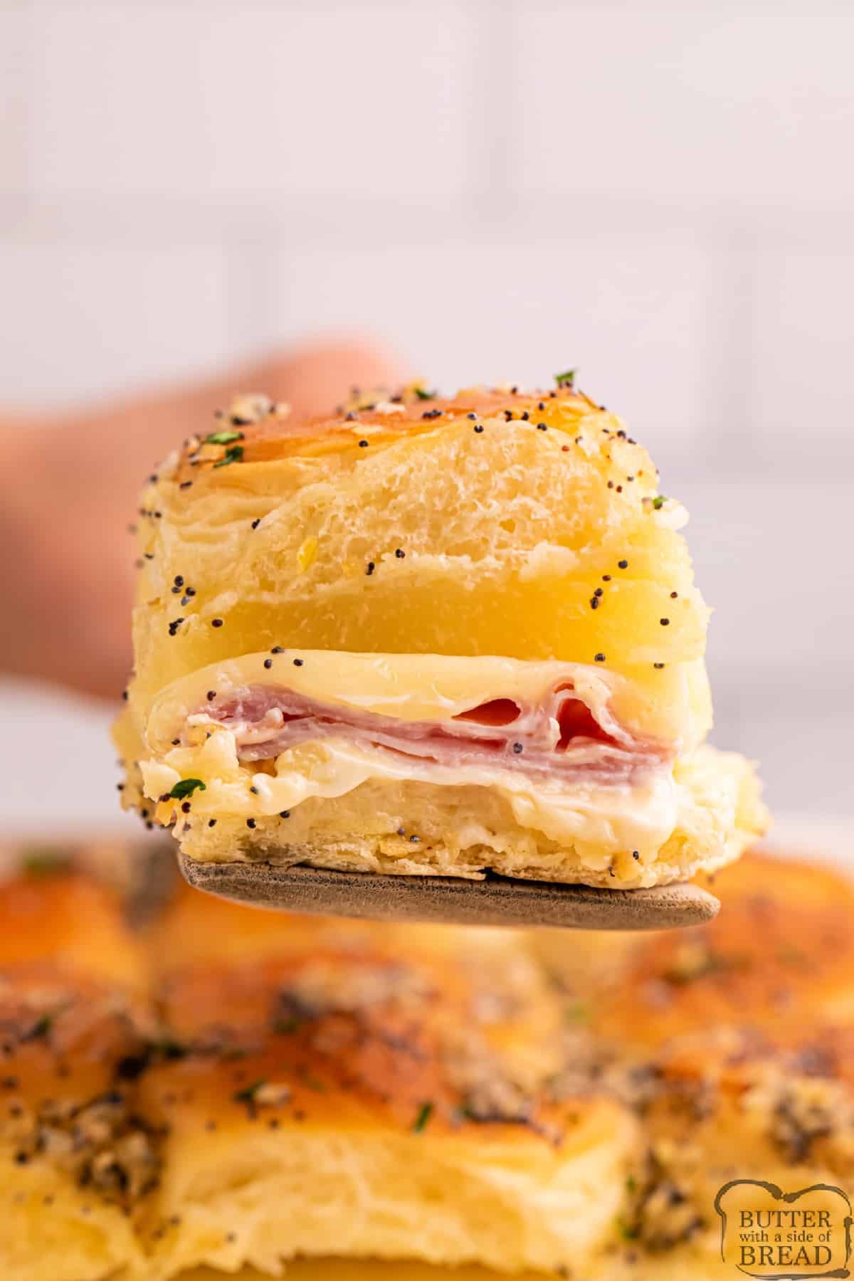 Slider made with pineapple, ham, and cheese. 