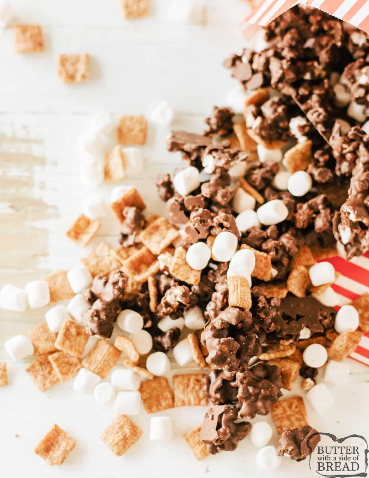 Popcorn mixed with chocolate, marshmallows, and cereal.