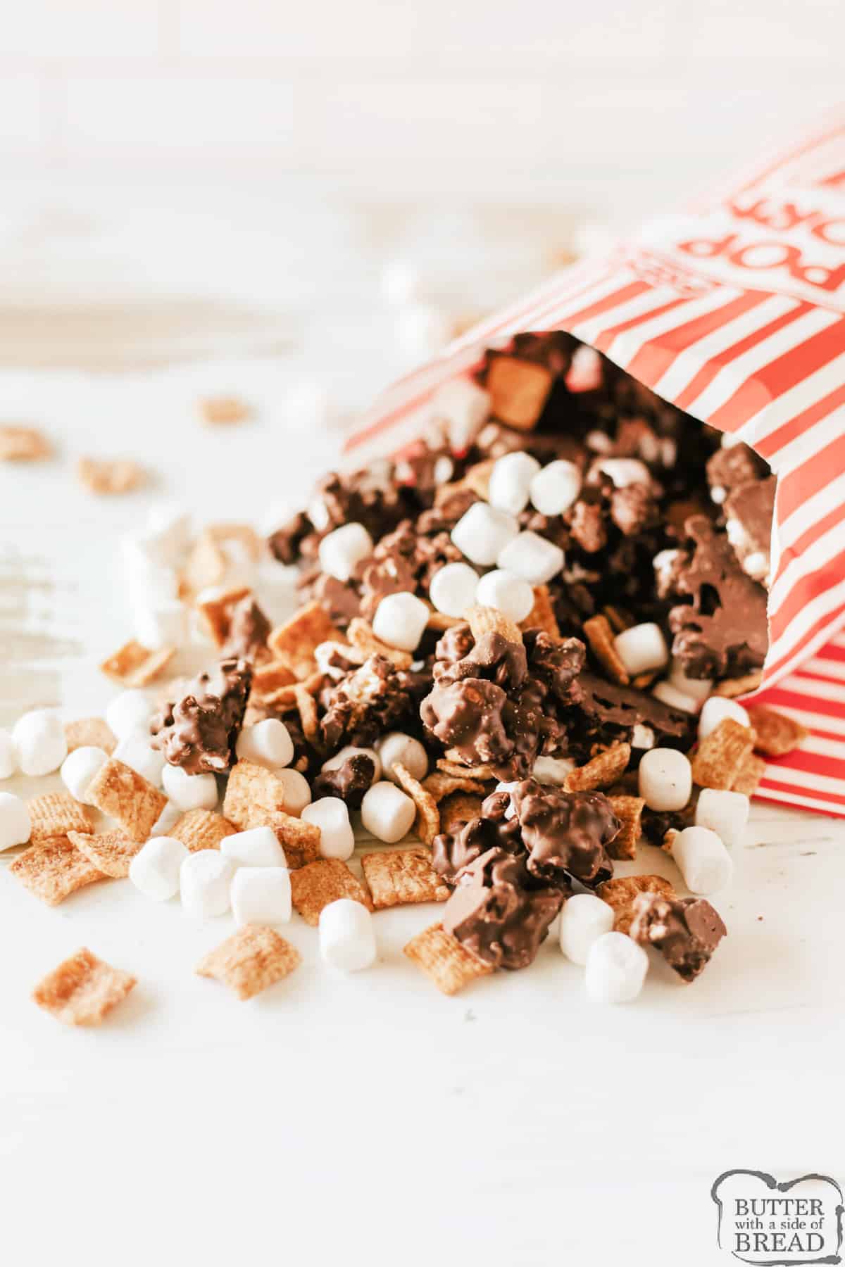 Bag of popcorn mixed with melted chocolate, marshmallows and cereal. 