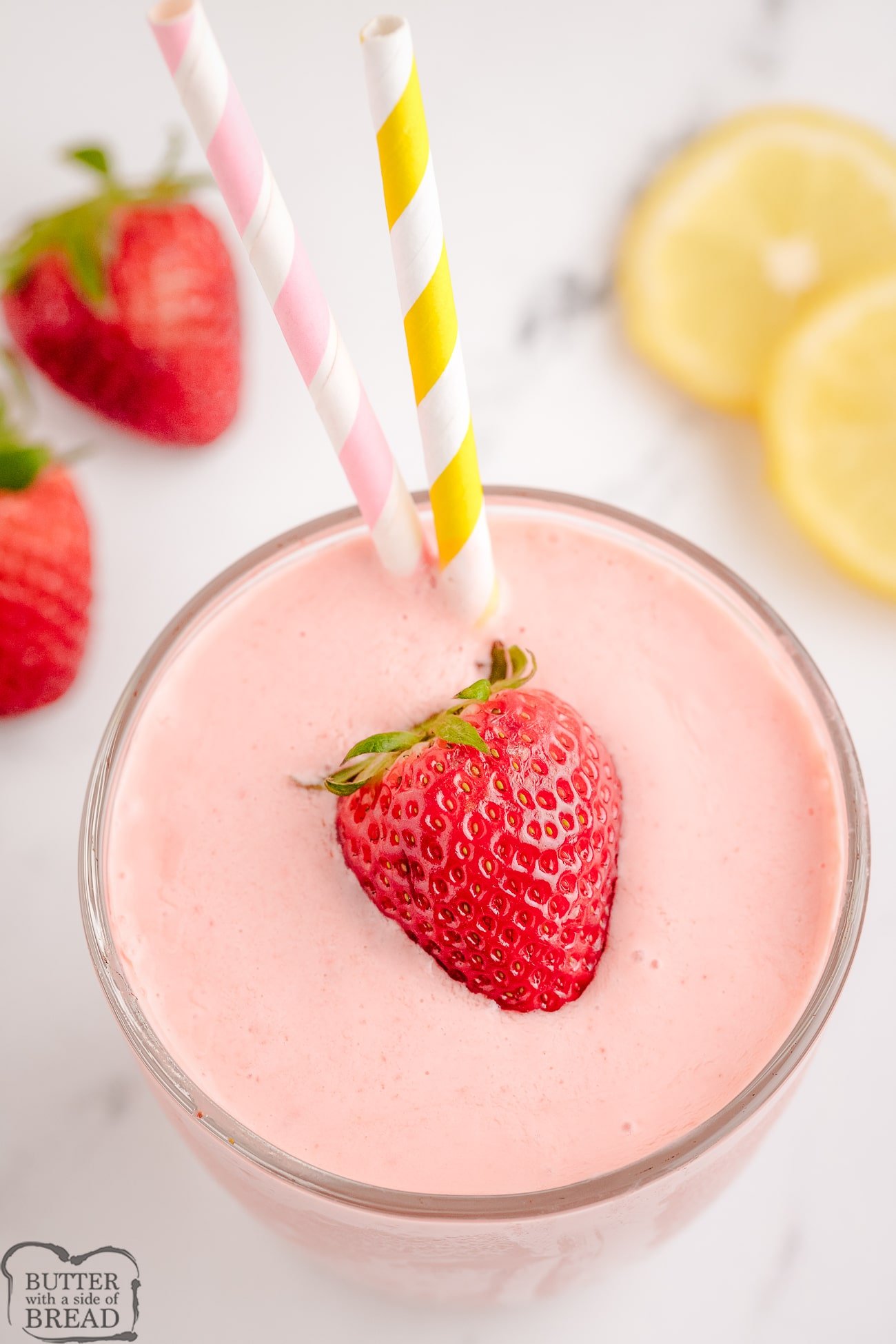 strawberry lemonade ice cream smoothie with a strawberry on top
