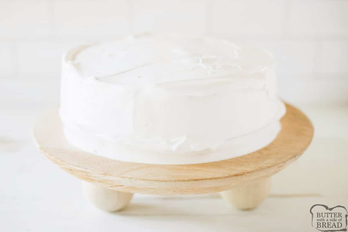 Frosting the icebox dessert with Cool Whip topping.