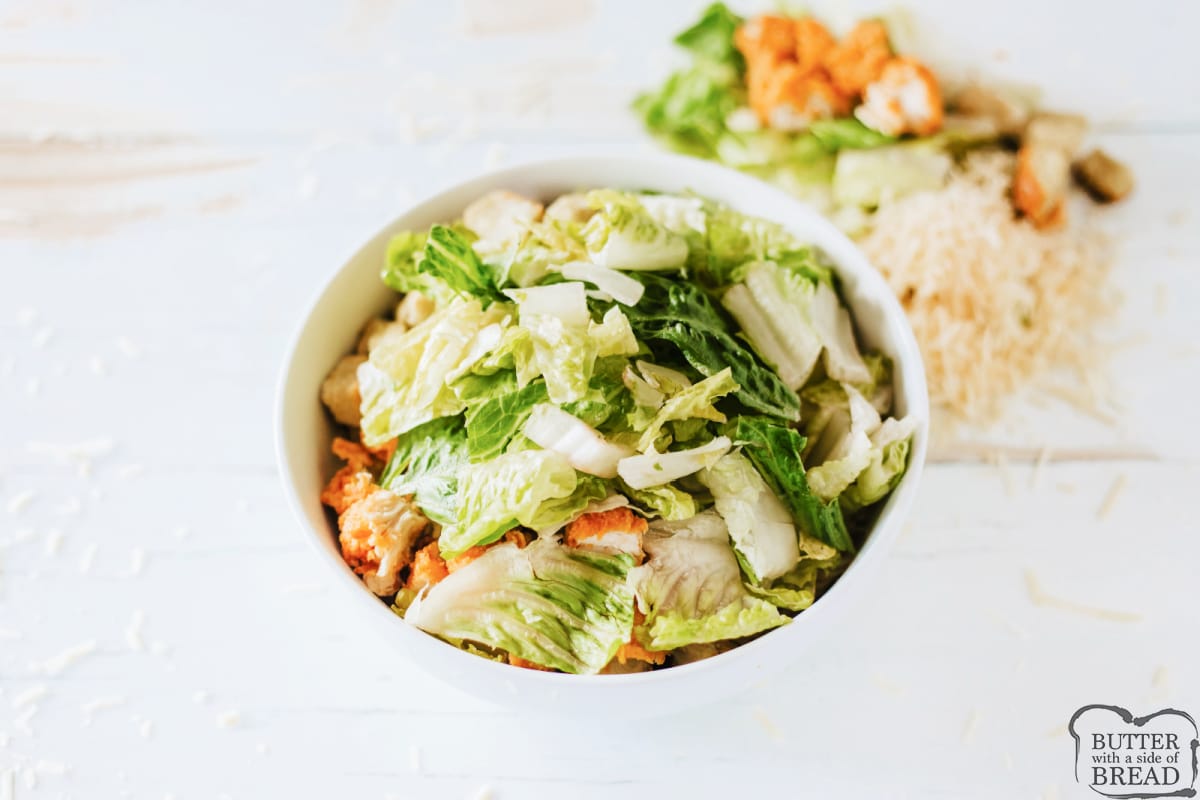 Add romaine lettuce to the bowl. 