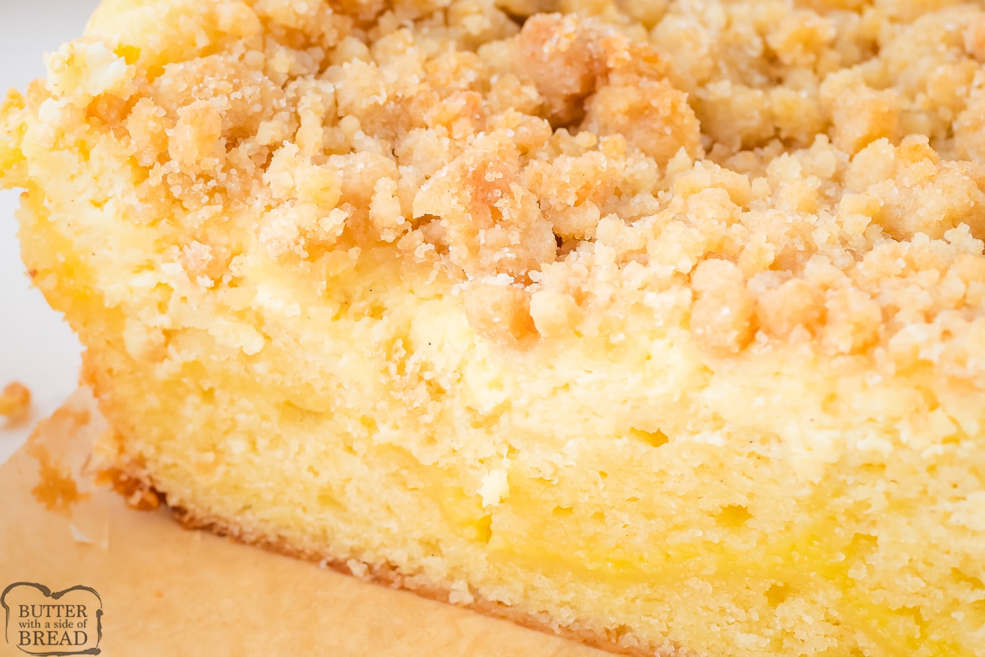 lemon crumb cake with a piece taken out