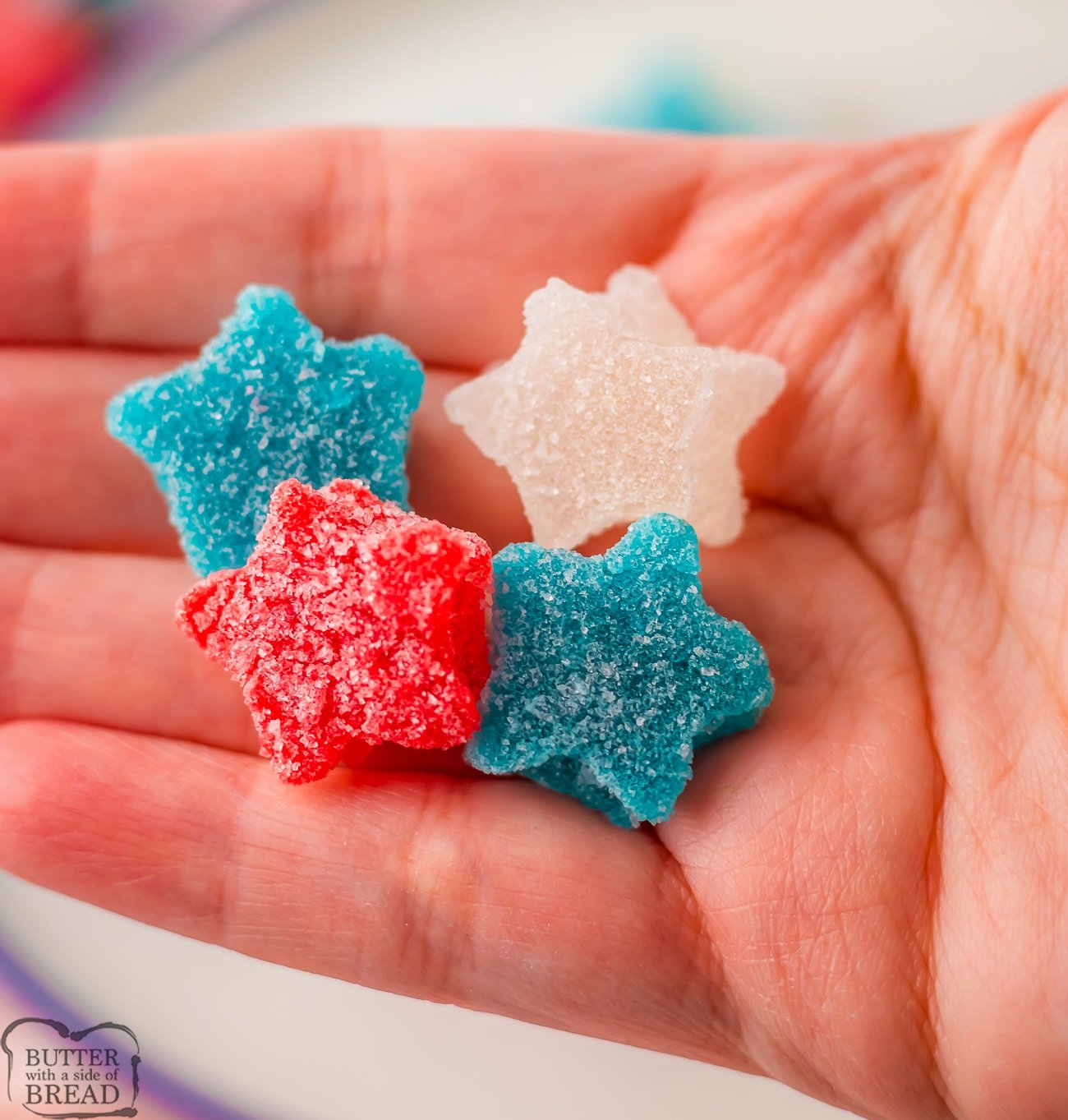 holding homemade red, white and blue star gumdrops in my hand